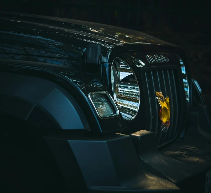a close up of the front of a black truck